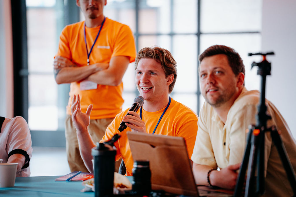 Attendee asking a question with a microphone at EVERYWHERE Summit