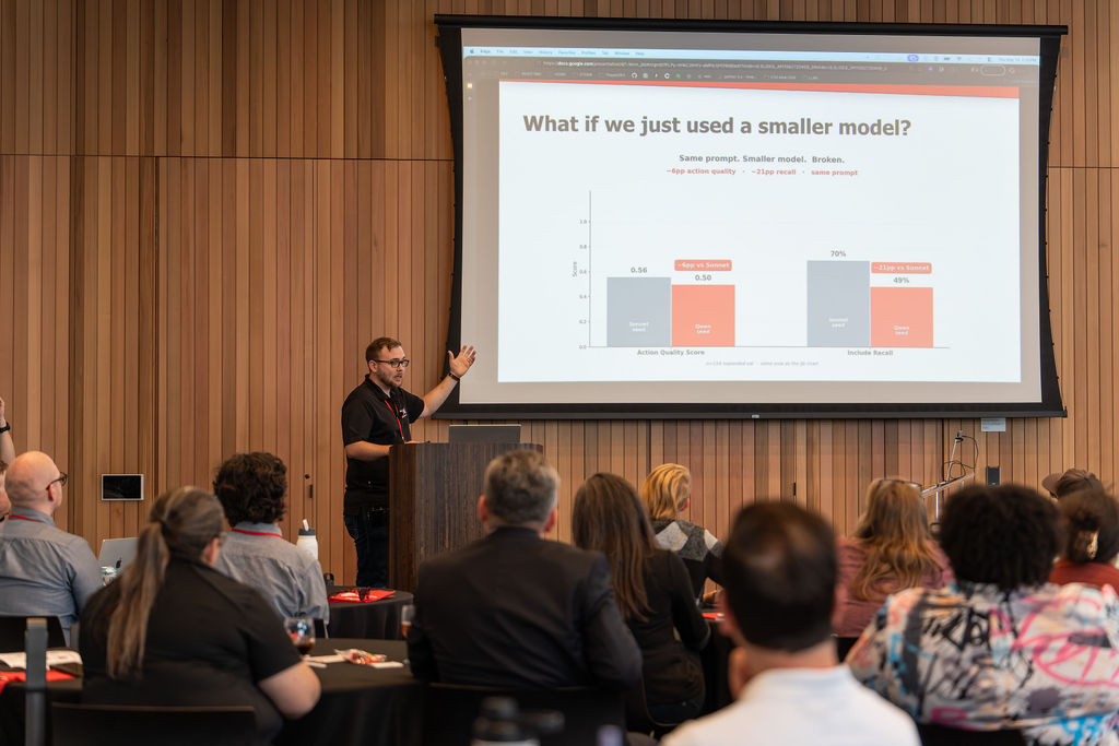 Presenter walking through an AI model comparison chart at CANalytics 2026