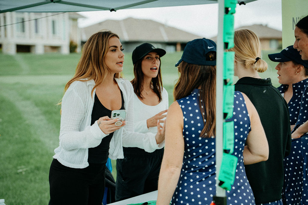 Players chatting at the check-in tent