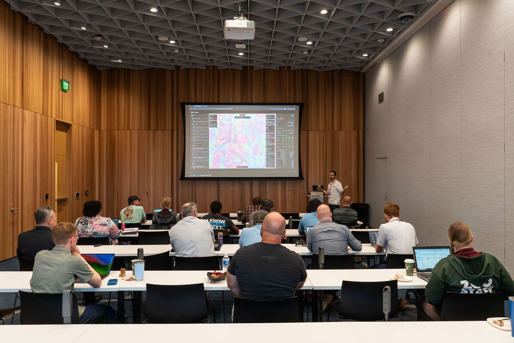 AI workshop attendees watching a presentation