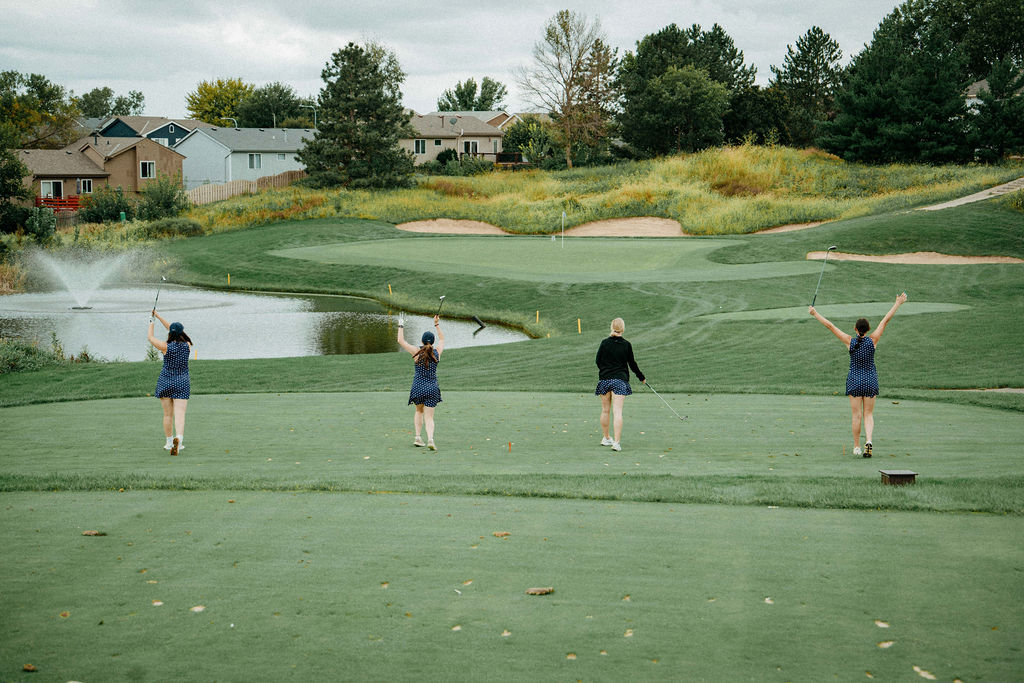 Golfers celebrating on the tee box at the Nebraska Startup Academy Golf Tournament